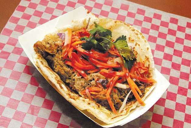 Get the Banh Mi Boys' pulled pork taco at a newly opened second location.