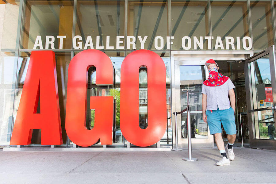 A photo of a masked visitor leaving reopened Art Gallery of Ontario on July 2, 2020.