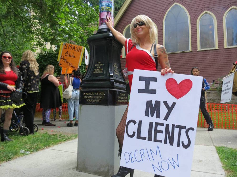 A photo of a sex worker protesting sex work law in Canada