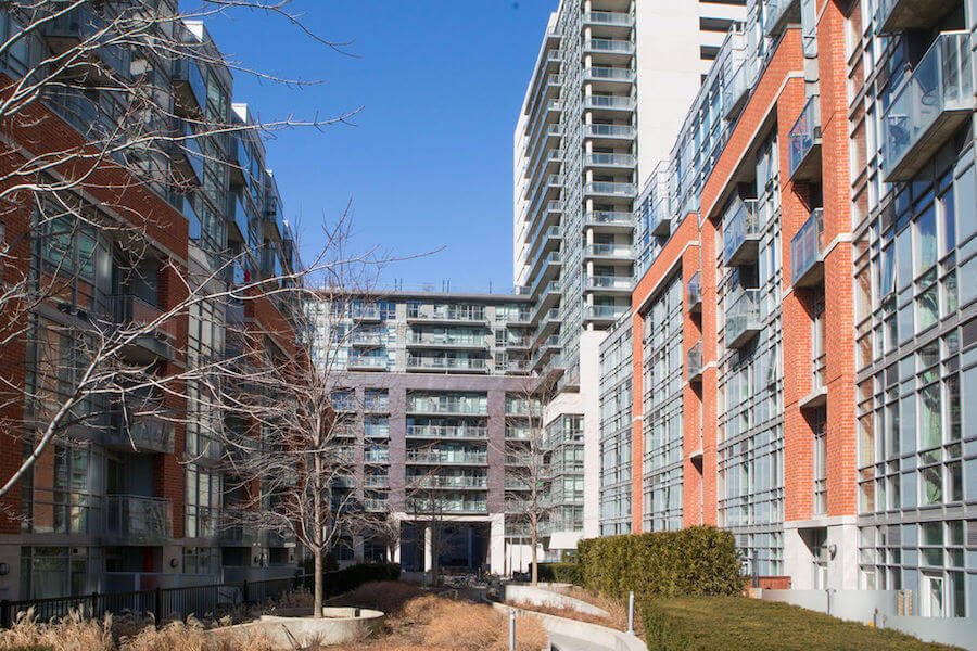 A photo of condos facing each other over a courtyard in Toronto