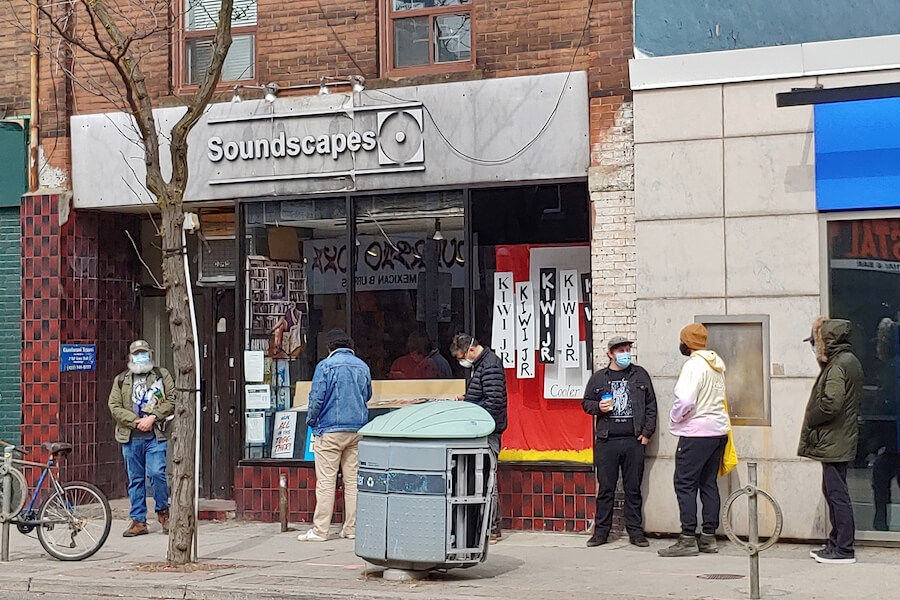 People line up outside Toronto record store Sounscapes in April 2021