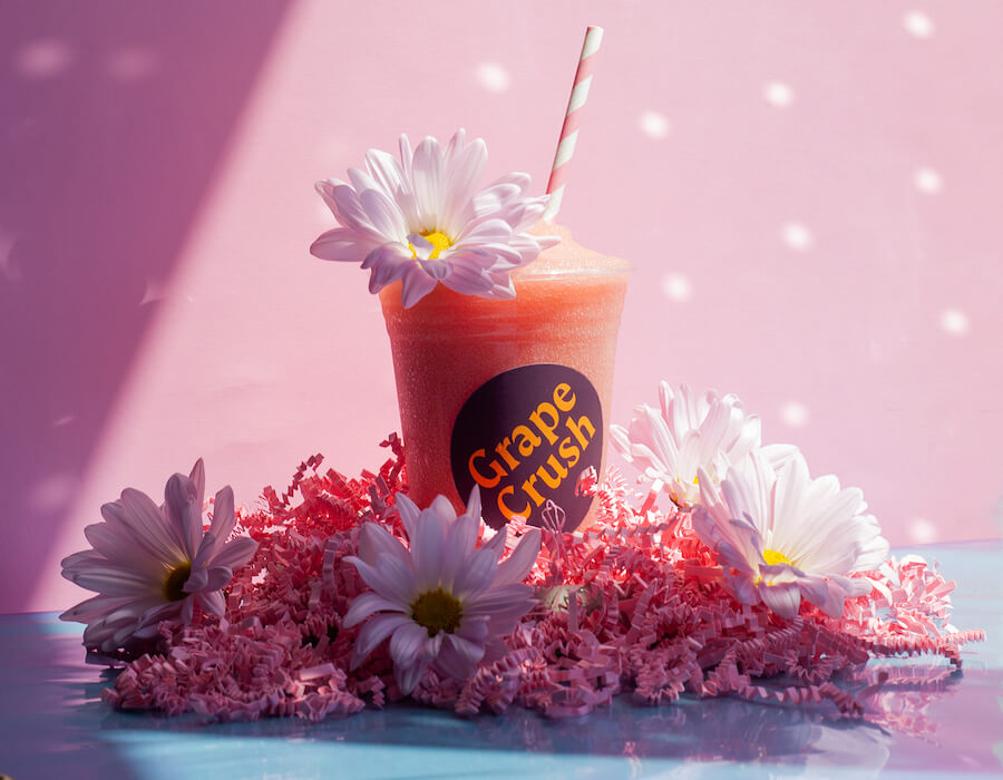A frosé surrounded by flowers from Grape Crush