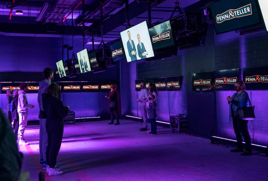 People watch a Penn and Teller show at Illusionarium