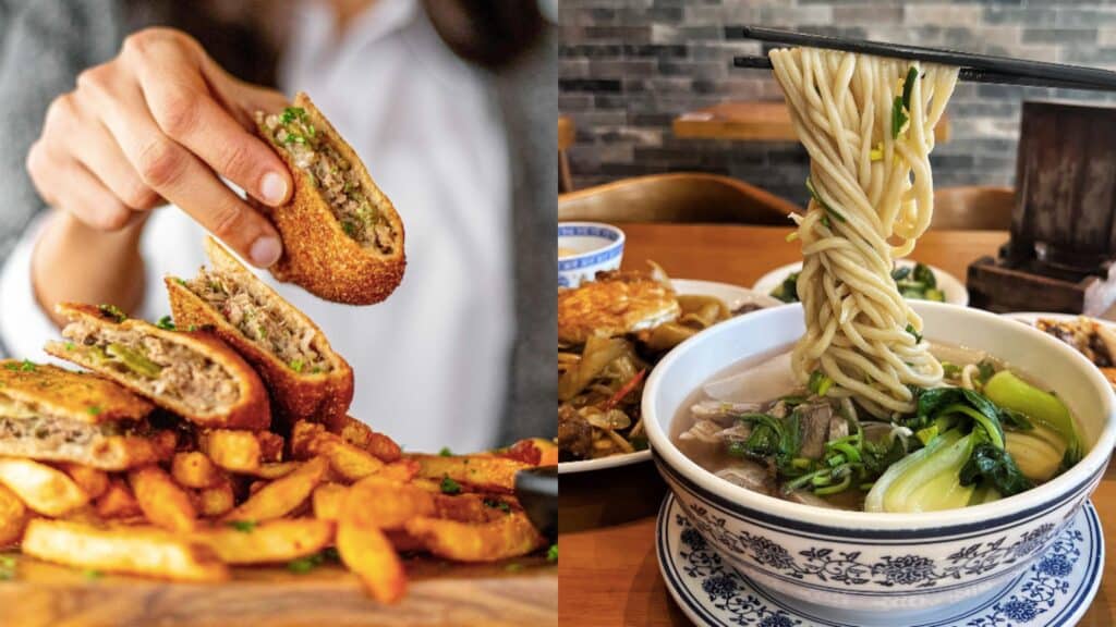 Hand holding a crispy beef egg roll with French fries on a wooden plate, side view.