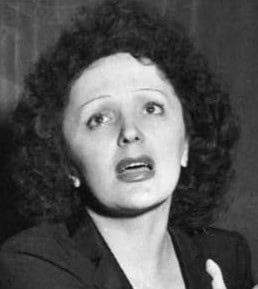 Black-and-white photo of a woman with curly hair looking surprised, representing impactful moments in Toronto's cultural or historical scene.