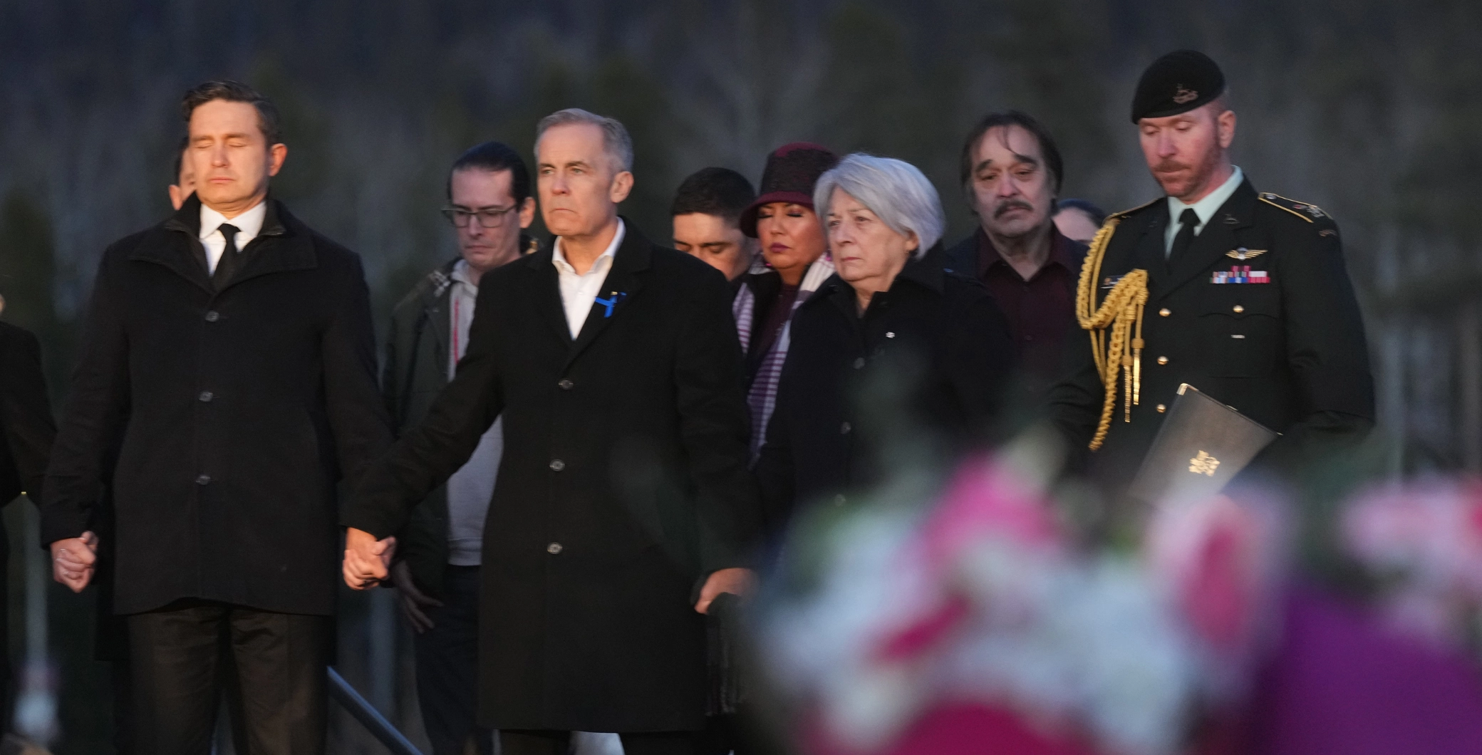 ‘Big respect,’ Canadians applaud unity after Mark Carney, Pierre Poilievre come together for Tumbler Ridge vigil