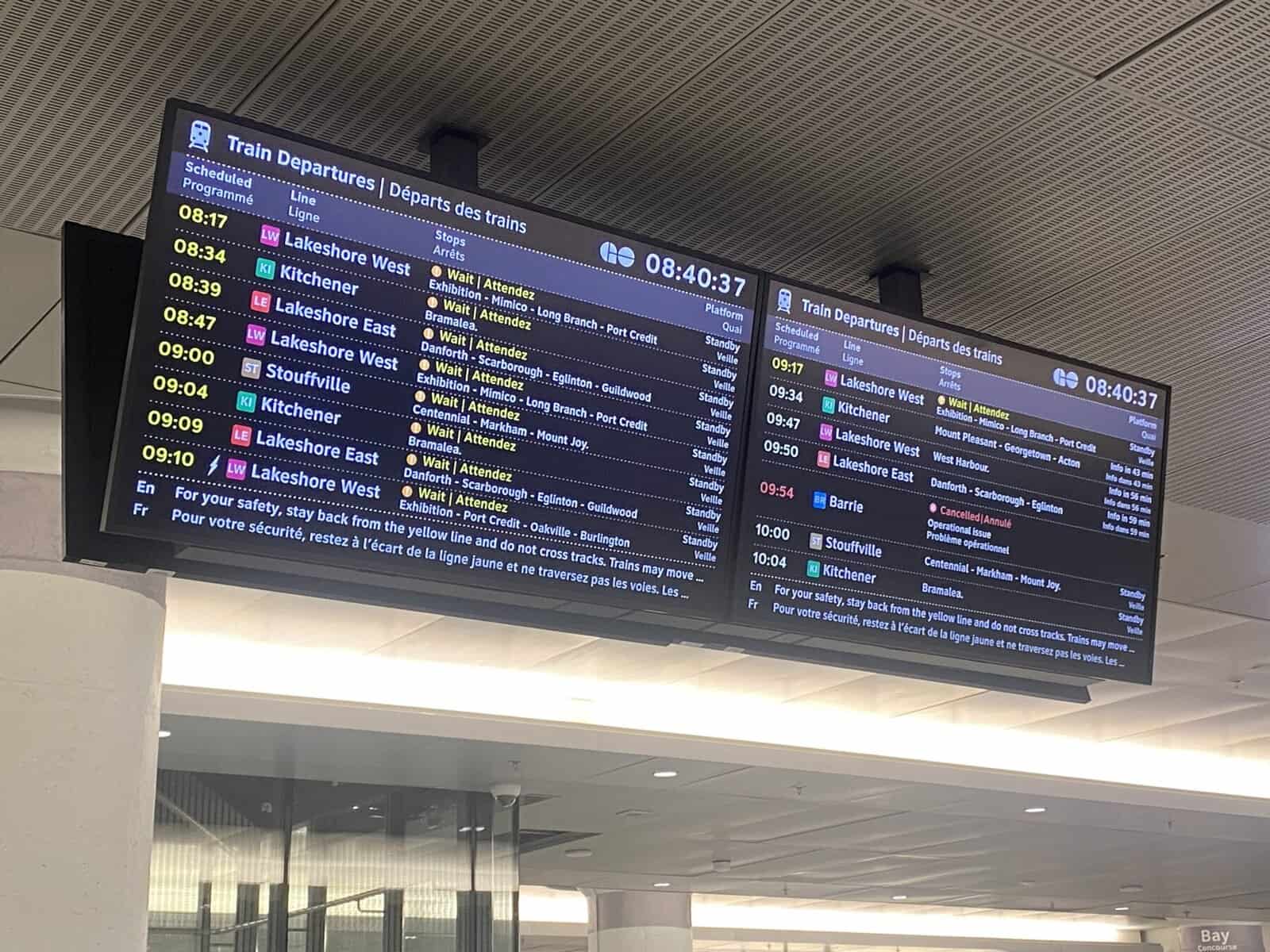 Digital train departure board at Toronto Union Station displaying schedules for Lakeshore West, Kitchener, and Lakeshore East lines in the morning.