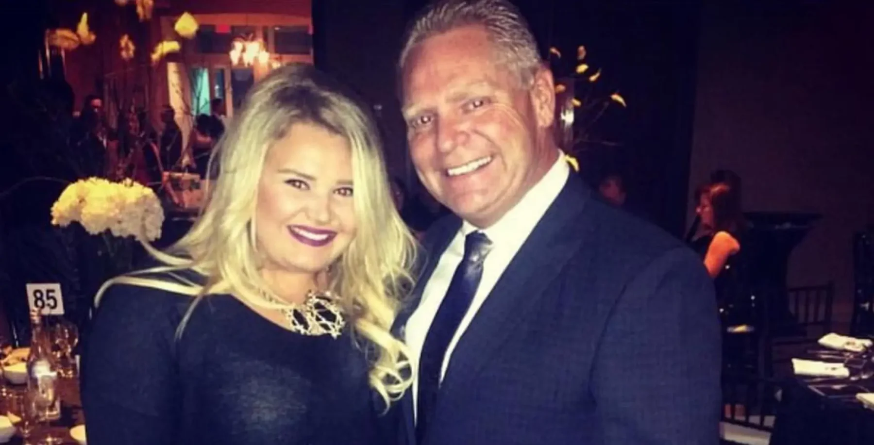 Image of Doug Ford’s daughter attending a formal event, smiling with a man in a suit, highlighting political family and public appearances.