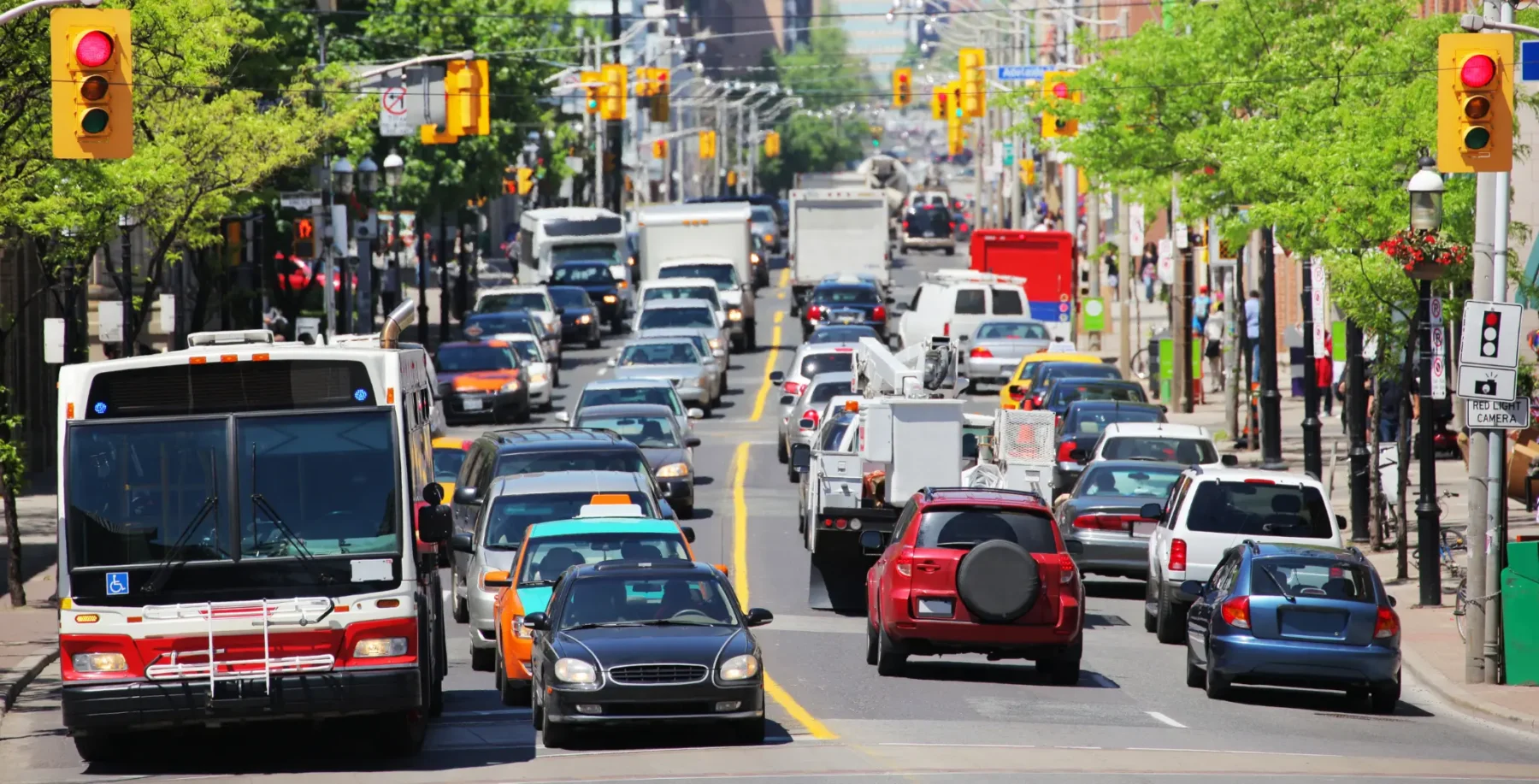 Busy Toronto street with heavy traffic and vehicles, illustrating the city's mobility plan ahead of FIFA World Cup summer matches.
