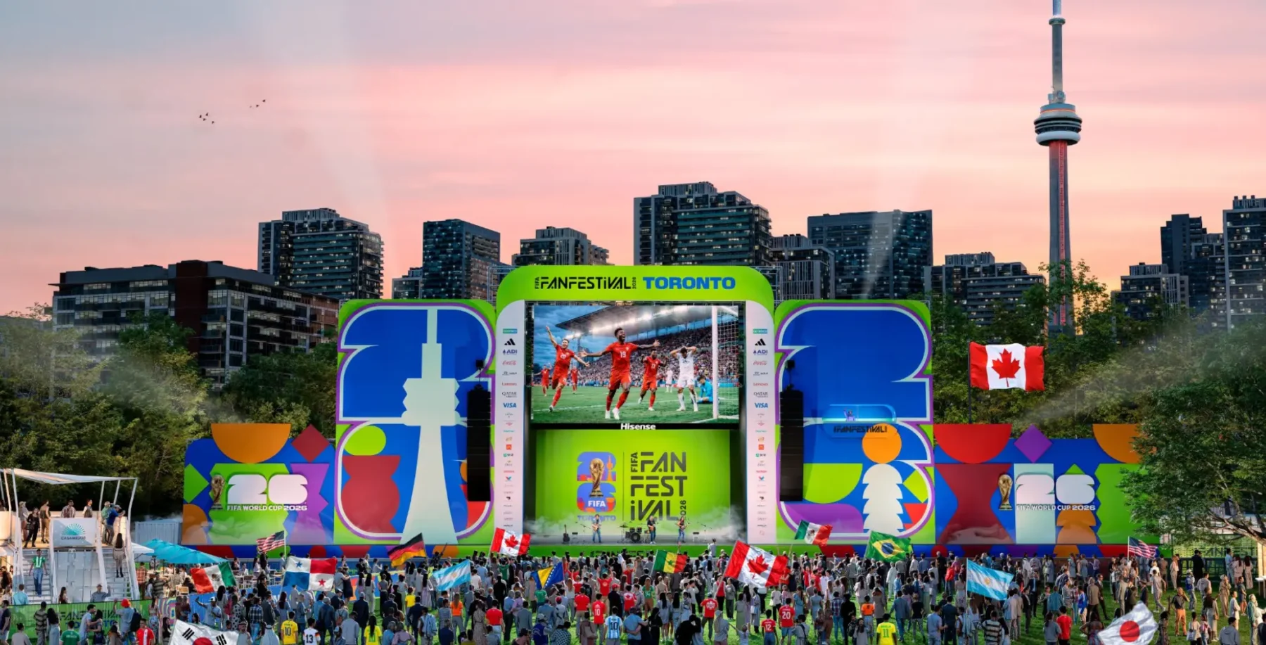 Toronto FIFA Fan Fest stage with large audience, city skyline, and screens displaying live football matches during the event in Toronto, Canada.
