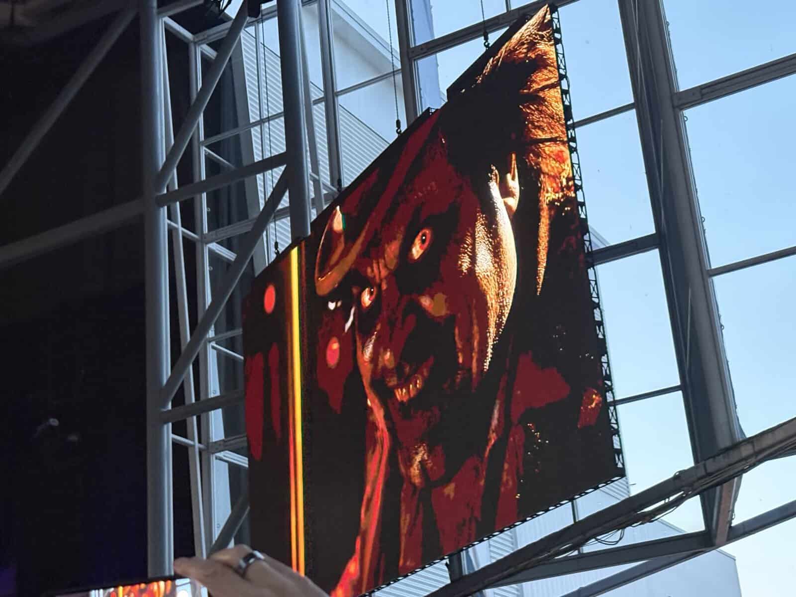 Large digital screen displays a menacing wolf with glowing eyes and sharp teeth at Toronto's RBC Amphitheatre during a concert.