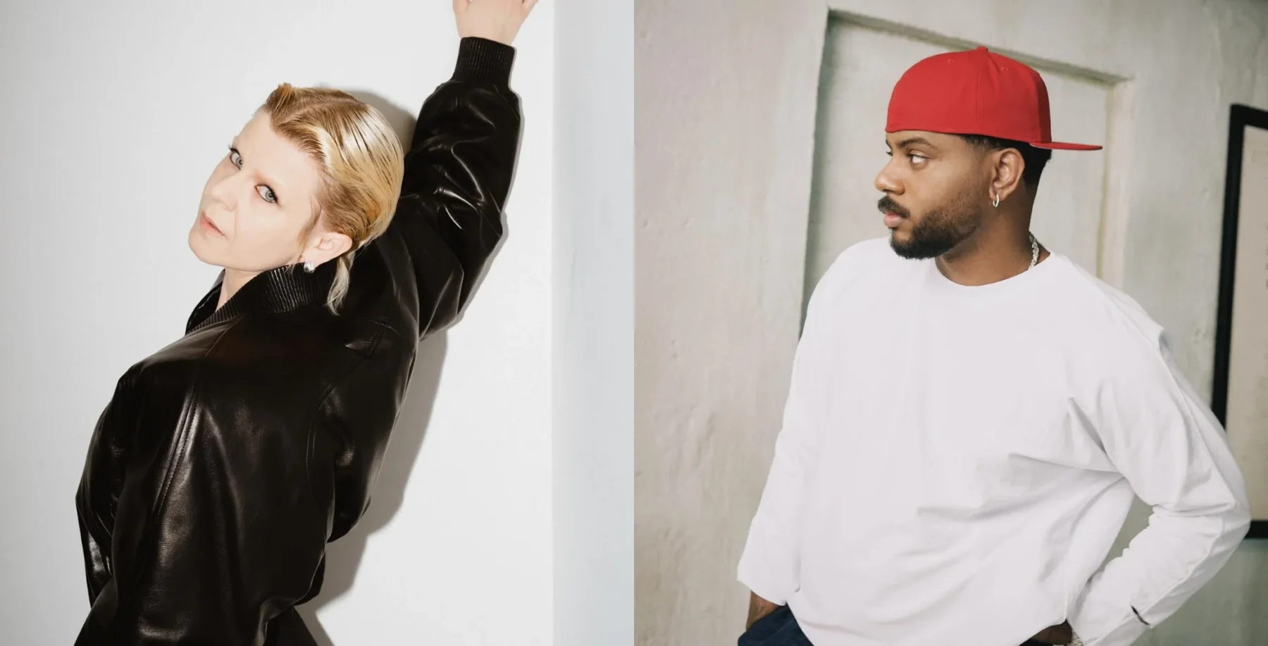 Two artists, a woman with blonde hair in a black leather jacket and a man with a red cap and white shirt, pose in a modern indoor setting.